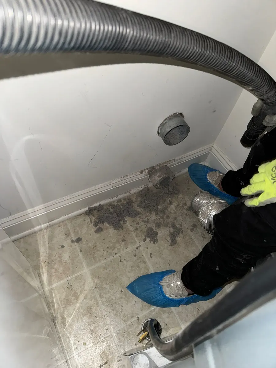 Dryer vent cleaning job photo — lint removed from a clogged vent line