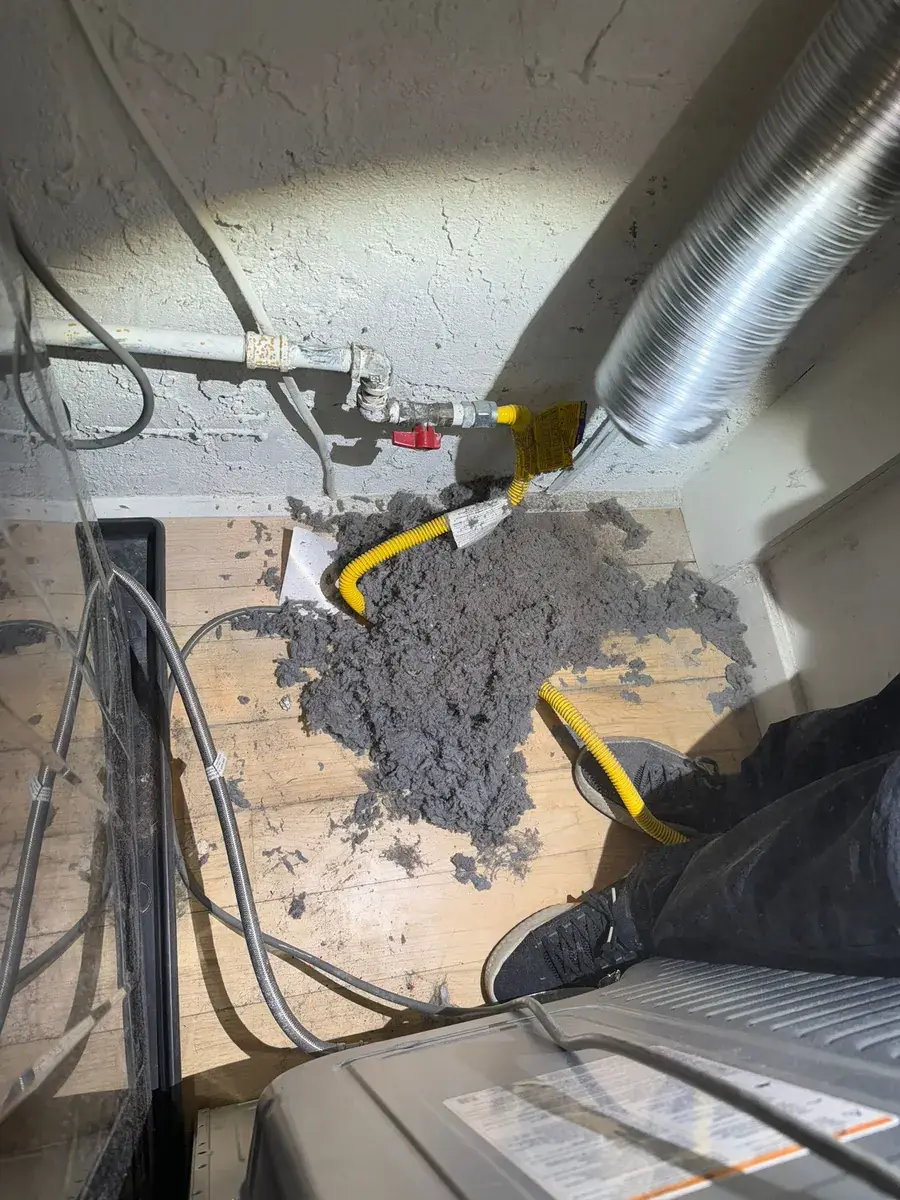 Dryer vent cleaning job photo — lint removed from a clogged vent line