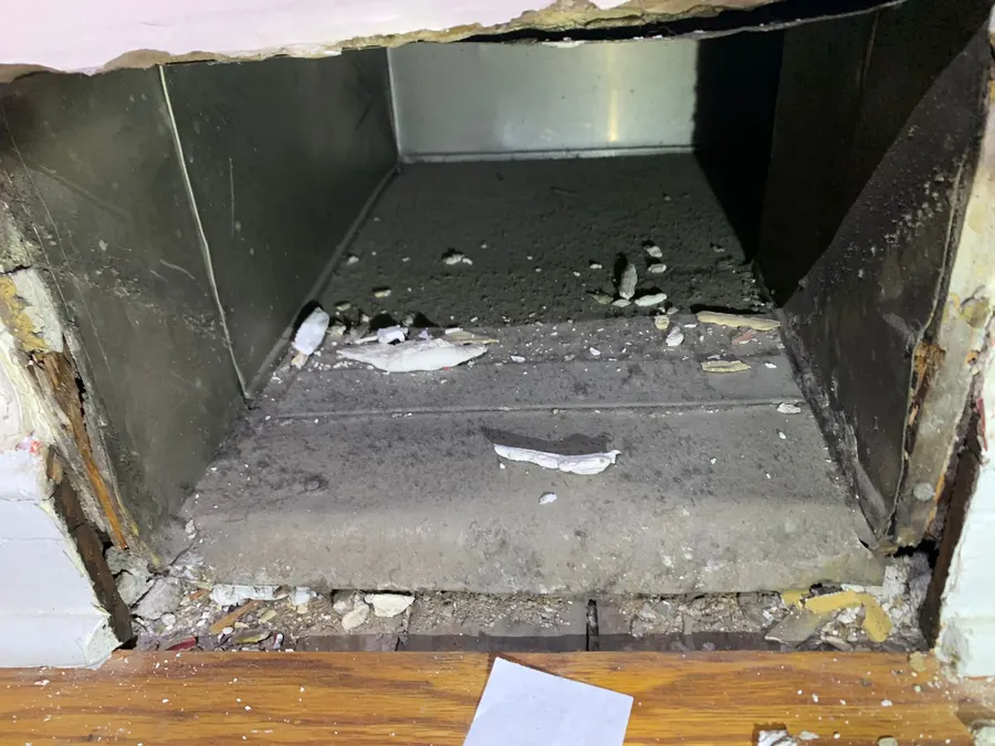 Trunk line with heavy debris buildup before cleaning